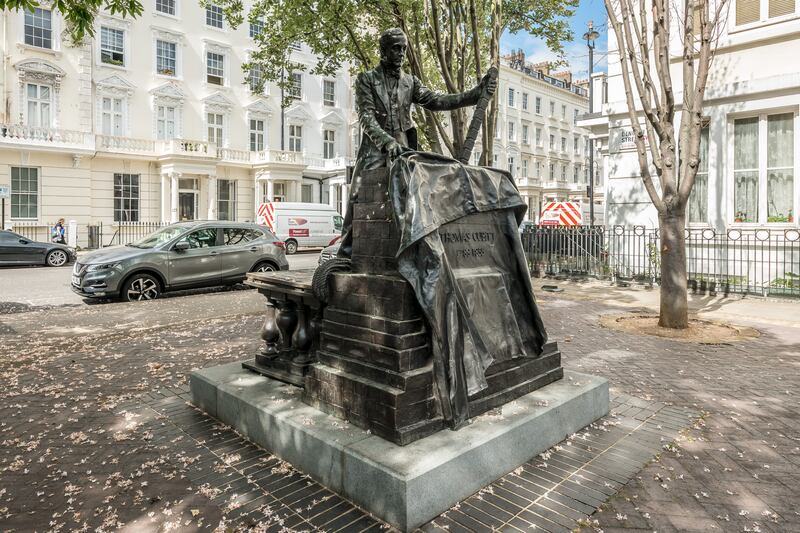 A statue of Thomas Cubitt stands close to house. Cubitt is an ancestor of Camilla, Duchess of Cornwall.