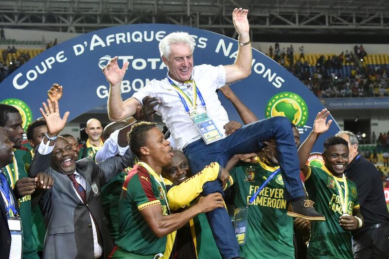 Cameroon players lift Belgian coach Hugo Broos as they celebrate. Issouf Sanogo / AFP