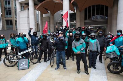 LONDON, ENGLAND - APRIL 7: Striking Deliveroo riders protest at the London Stock Exchange on April 6, 2021 in London, England. Deliveroo riders strike for better pay, better rights and better safety. (Photo by Guy Smallman/Getty Images)