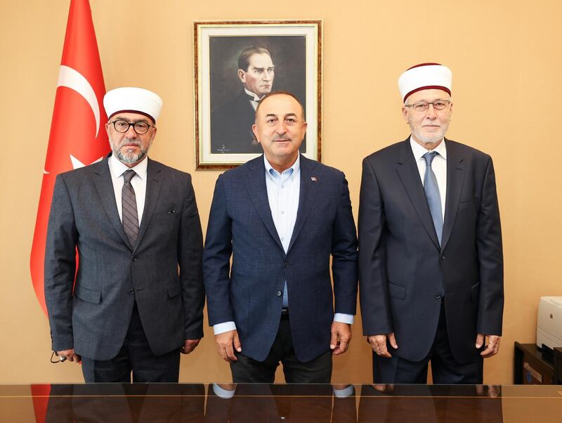 Turkish Foreign Minister Mevlut Cavusoglu meets with Muslim clerics Ibrahim Serif and Ahmet Mete in Komotini, Greece May 30, 2021. Cem Ozdel/Turkish Foreign Ministry /Handout via REUTERS ATTENTION EDITORS - THIS PICTURE WAS PROVIDED BY A THIRD PARTY. NO RESALES. NO ARCHIVE.