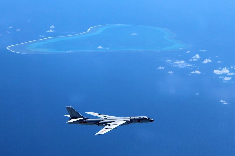 A Chinese bomber patrols the islands and reefs in the South China Sea. Liu Rui / Xinhua via AP