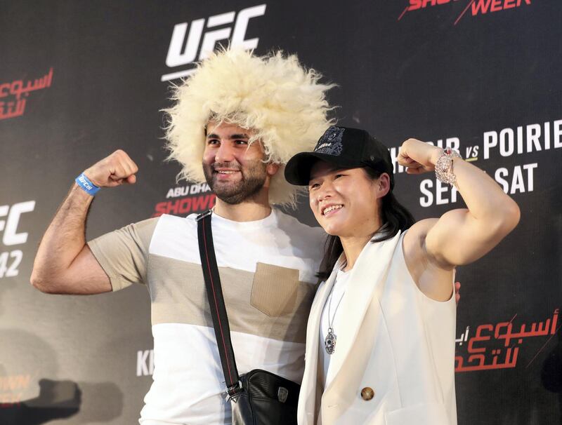 Abu Dhabi, United Arab Emirates - September 06, 2019: Fight fans with fighter Wei Lee at the UFC fan zone. Friday the 6th of September 2019. Yes Island, Abu Dhabi. Chris Whiteoak / The National