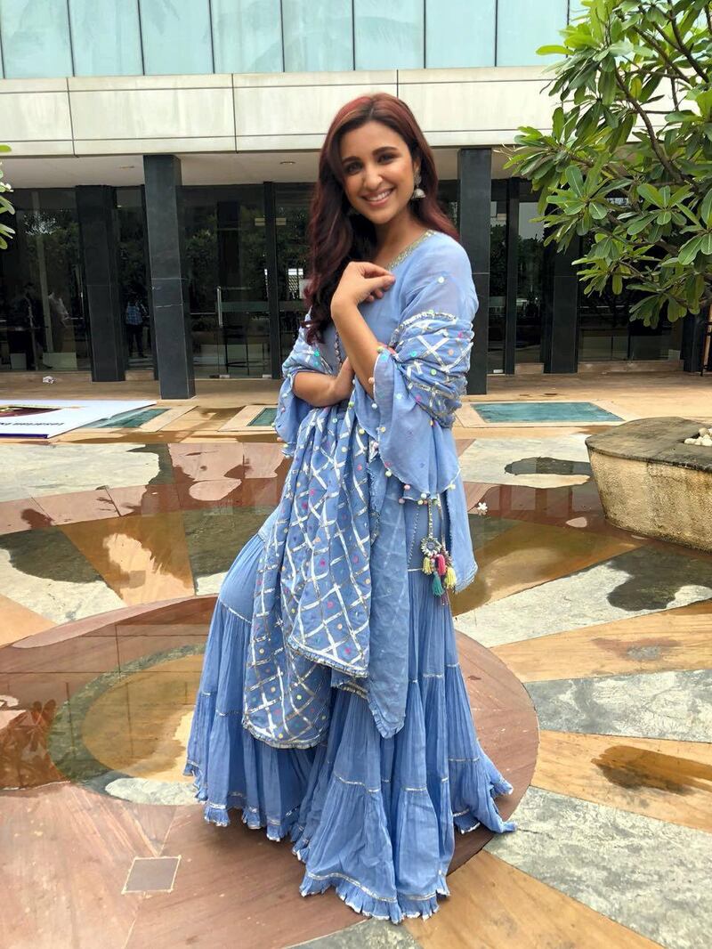 Parineeti Chopra in a bird's-egg blue outfit with pom-pom embellishments 