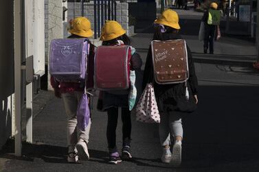 Elementary school students make their way home in Ichikawa, Japan. Some schools closed as Covid-19 cases continued to increase. Getty