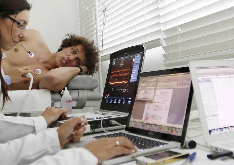 A handout photo released by the Brazilian Football Confederation (CBF) shows Brazil's national team player David Luiz during a medical test at Brazil's training camp in Teresopolis, Brazil, on Monday. Rafael Ribeiro / EPA / CBF / May 26, 2014