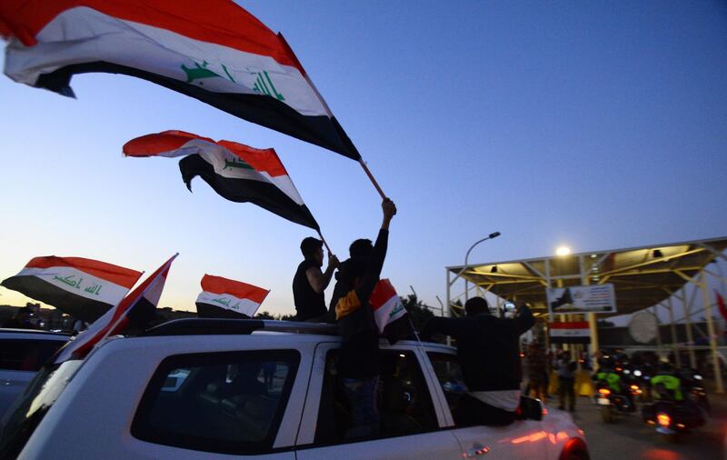 Iraqis prepare to cross a checkpoint as they celebrate the re-opening of the Green Zone. AFP