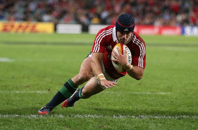 SYDNEY, AUSTRALIA - JUNE 15:  Leigh Halfpenny, the Lions fullback, dives over for the Lions second try during the match between the NSW Waratahs and the British & Irish Lions at Allianz Stadium on June 15, 2013 in Sydney, Australia.  (Photo by David Rogers/Getty Images) *** Local Caption ***  170594957.jpg