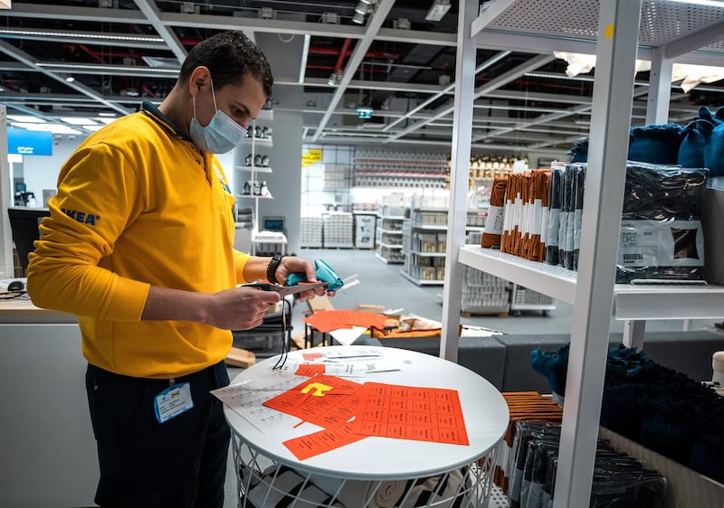 Abu Dhabi, United Arab Emirates, November 8, 2020.   A first look at the IKEA store at Al Wahda Mall before the opening on Tuesday, November 10.  IKEA store staff tag some prices before the opening on Tuesday.
Victor Besa/The National
Section:  LF
Reporter:  Farah Andrews