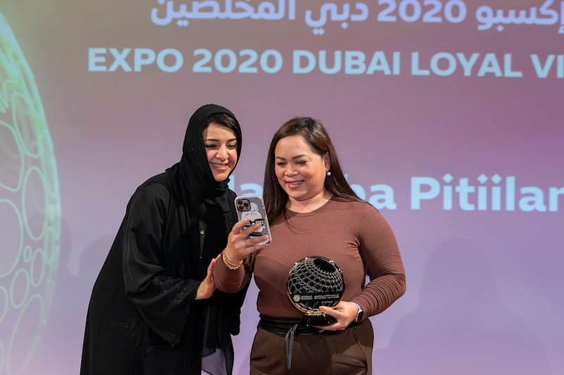 Ms Al Hashimy and Nashiba Pitilian pose for an on-stage selfie at the Expo Champions awards ceremony. Photo: Expo 2020 Dubai