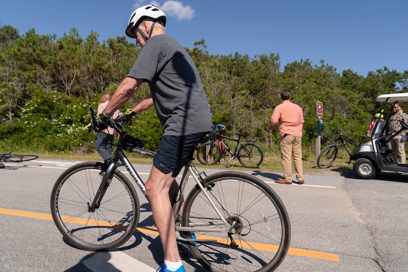 Mr Biden got straight back on his bike after his tumble, and suffered no obvious physical injuries. AP