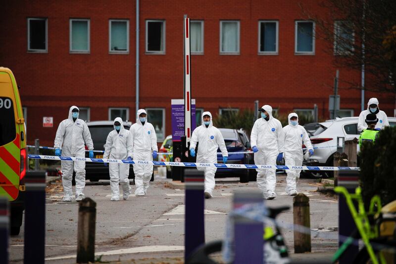Forensic police officers leave the scene outside Liverpool Women's Hospital. Reuters