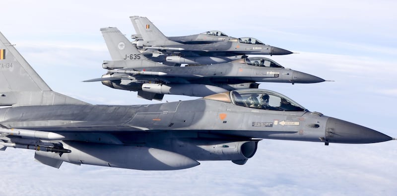 Dutch and Belgian F16 aircrafts fly over the Netherlands prior to the signing of an agreement between Benelux countries to work together to monitor the national airspace by civilian aircraft that posed a terrorist threat, in Rotterdam, on December 21, 2016. / AFP PHOTO / ANP / Jerry Lampen / Netherlands OUT
