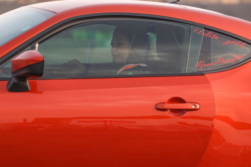 The instructor behind the wheel on the race track.  AFP