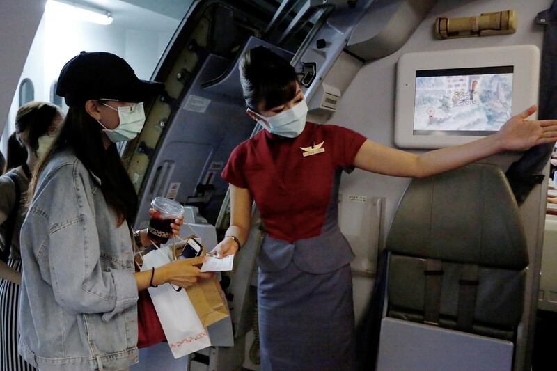 People who want to leave the island, but cannot due to coronavirus disease-related travel restrictions, take part in a "fake" travel experience for tourists simulating the experience of using an international airport at Songshan airport in Taipei, Taiwan. Reuters