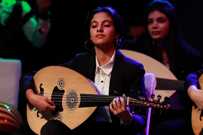 Iraqi musicians play the oud during a concert in Baghdad