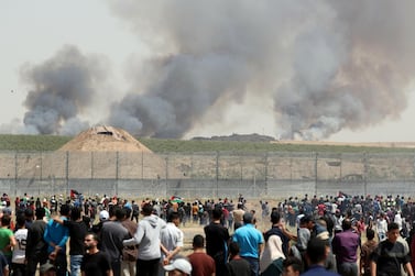 Smoke rises as Palestinians take part in a protest marking the 71st anniversary of the 'Nakba', or catastrophe at the Israel-Gaza border fence, east of Gaza City, May 15, 2019. Reuters