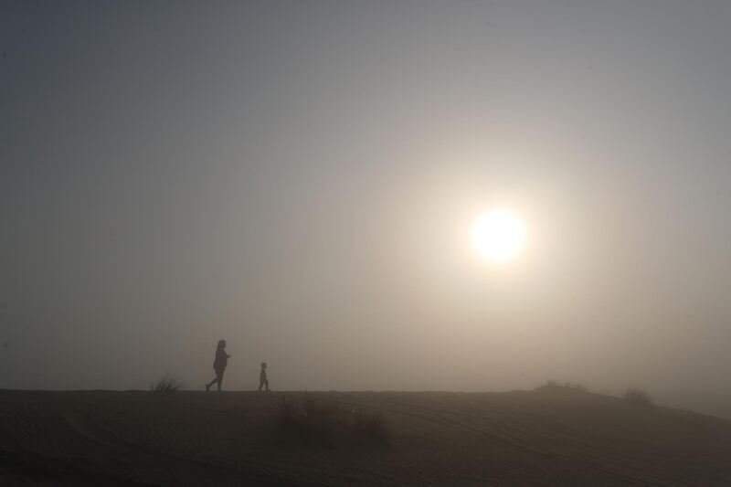 Dubai, United Arab Emirates - Reporter: N/A. News. Weather. A family go for an early morning walk in the desert during heavy fog in Dubai. Saturday, February 13th, 2021. Dubai. Chris Whiteoak / The National