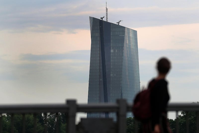 A pedestrian looks towards the European Central Bank (ECB) skyscraper headquarters in Frankfurt, Germany, on Wednesday, May 23, 2018. Frankfurt has emerged as the biggest winner in the fight for thousands of London-based jobs that will have to be relocated to new hubs inside the European Union after Brexit. Photographer: Krisztian Bocsi/Bloomberg