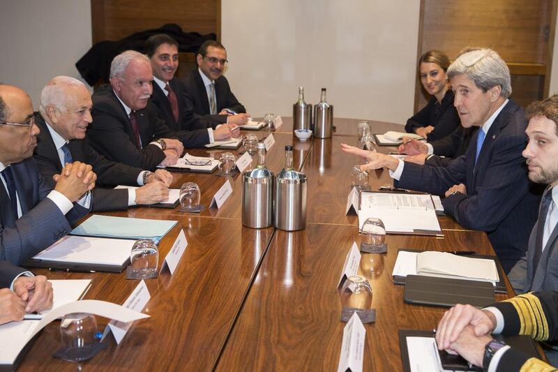 The US secretary of state John Kerry, second right, meets Arab League secretary general Nabil Al Araby, second from left, in London on December 16, 2014, to discuss the peace process between the Israelis and Palestinians. Evan Vucci / AP Photo