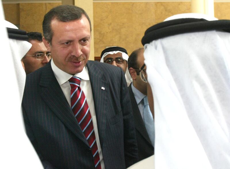 Mr Erdogan with Emirati officials at the International Monetary Fund conference that was held in Dubai in September 2003. AFP