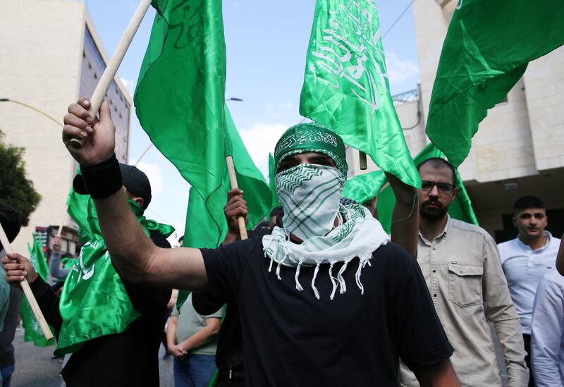 Palestinian demonstrators loyal to Hamas protesting in West Bank. Mohammad Roummaneh was killed by Israeli forces on Friday. EPA