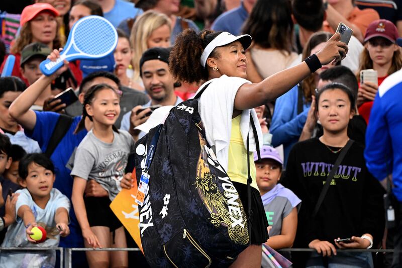 Naomi Osaka takes a selfie with fans after victory in her match against Tamara Korpatsch at the Brisbane International in Brisbane, Australia on January 1, 2024. AFP