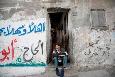 An elderly man sits on the doorstep of his home at Al Bureij refugee camp in central Gaza Strip, as Palestinians prepare to mark the 72nd anniversary of the Nakba, on May 14, 2020. AFP