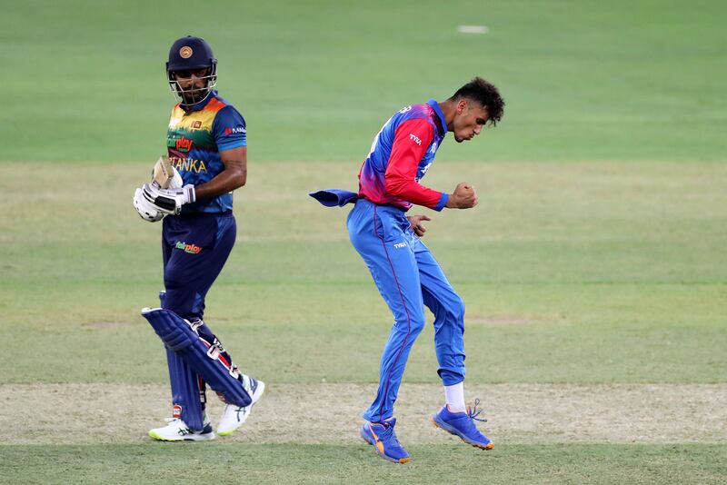 Afghanistan's Mujeeb Ur Rahman celebrates the wicket of Sri Lanka's Danushka Gunathilaka. Chris Whiteoak / The National
