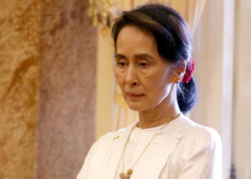 Myanmar's leader Aung San Suu Kyi waits for a meeting with Vietnam's President Tran Dai Quang (not pictured) at the Presidential Palace during the World Economic Forum on ASEAN in Hanoi, Vietnam, Thursday, Sept. 13, 2018, (Kham/Pool Photo via AP)