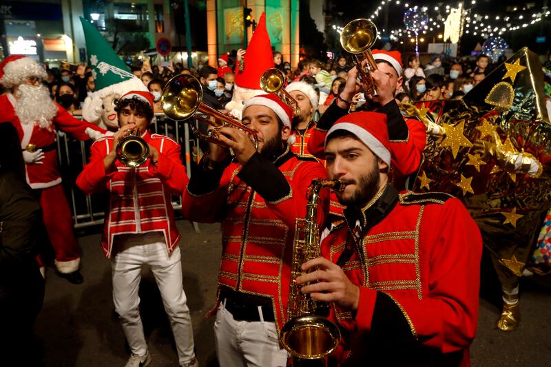 A brass band in festive attire perform at the launch of Christmas festivities at Sassine Square. AP Photo