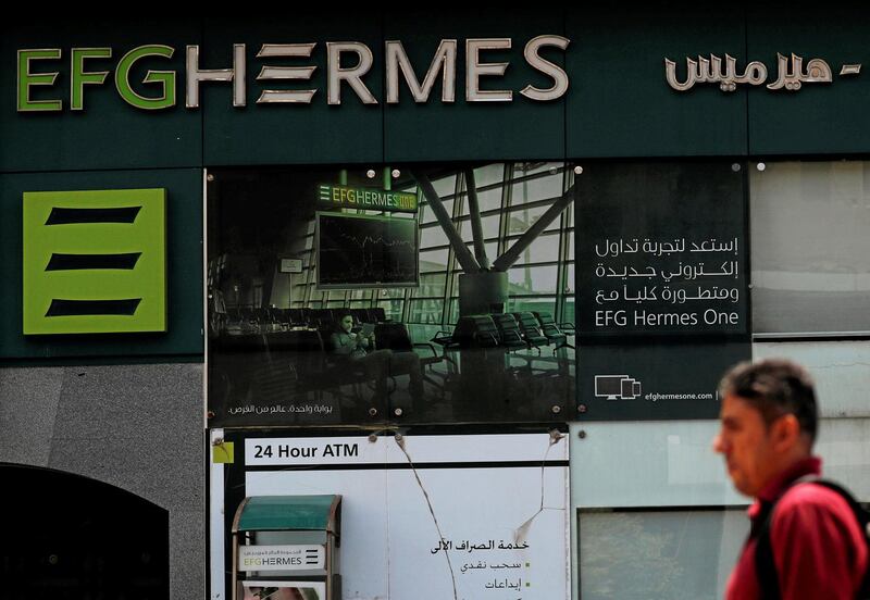 FILE PHOTO: An Egyptian man walks past a branch of the EFG Hermes investment bank in Cairo, Egypt May 29, 2018. REUTERS/Amr Abdallah Dalsh/File Photo