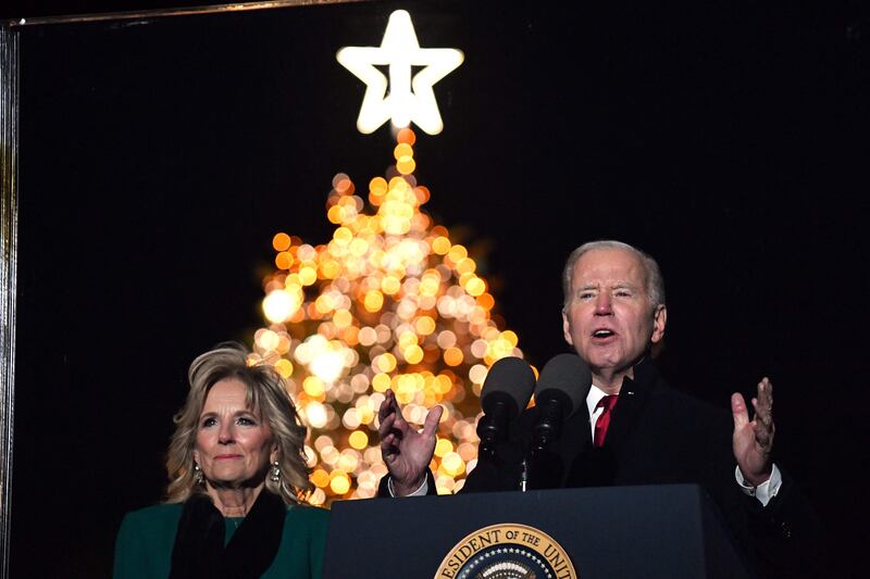 US President Joe Biden speaks alongside his wife Jill at the National Christmas Tree lighting on lhe Ellipse, south of the White House in Washington, on Wednesday.  AFP