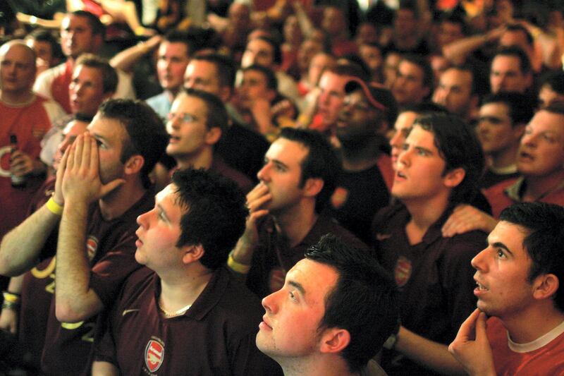 LONDON - MAY 17:  Arsenal fans watch the game between Arsenal and Barcelona during European Cup final at the Gunners pub May 17, 2006 in London. Arsenal played Barcelona in the Champions League Final at the Stade de France in Paris.  (Photo by Bruno Vincent/Getty Images)