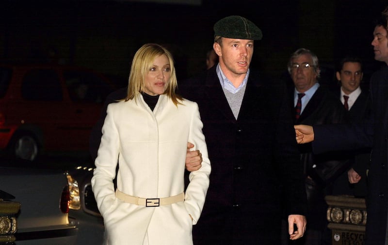 398820 08: Singer Madonna and husband, film director Guy Ritchie arrive for the World Premiere of the film ''Mean Machine'' December 18, 2001 at the Kensington Odeon cinema in London. The film stars British ex-soccer player Vinnie Jones and is executive produced by Guy Ritchie. (Photo by Sion Touhig/Getty Images)