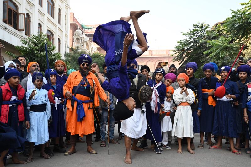 A Sikh youth performs 'Gatka', an ancient form of Sikh martial arts, on the martyrdom day of Guru Teg Bahadur at the Golden Temple in Amritsar. AFP