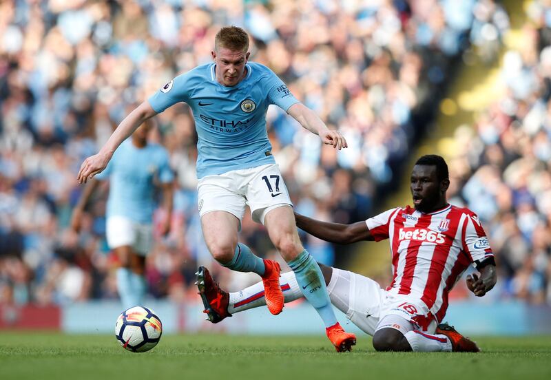 Soccer Football - Premier League - Manchester City vs Stoke City - Etihad Stadium, Manchester, Britain - October 14, 2017   Manchester City's Kevin De Bruyne in action with Stoke City's Mame Biram Diouf    REUTERS/Andrew Yates    EDITORIAL USE ONLY. No use with unauthorized audio, video, data, fixture lists, club/league logos or "live" services. Online in-match use limited to 75 images, no video emulation. No use in betting, games or single club/league/player publications. Please contact your account representative for further details.