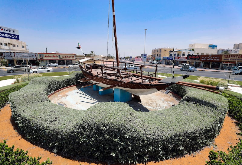 A traditional sailing vessel in the middle of a Ras Al Khaimah roundabout.