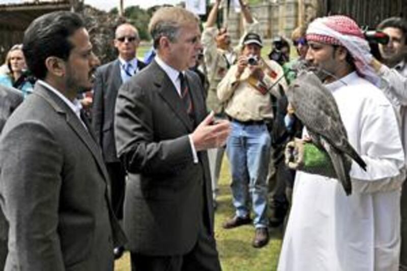 Sheikh Sultan Bin Tahnoun, chairman of the Abu Dhabi Tourism Authority, presents Prince Andrew with the gyrfalcon.