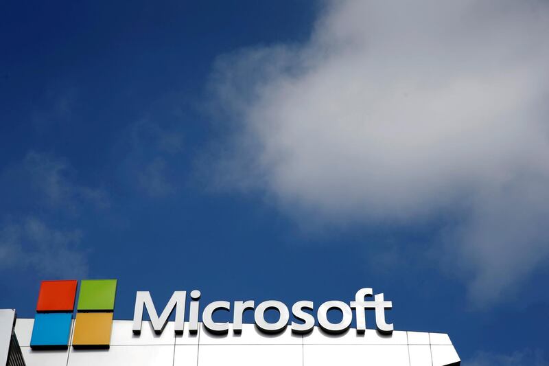 FILE PHOTO: A Microsoft logo is seen next to a cloud in Los Angeles, California, U.S. on June 14, 2016.   REUTERS/Lucy Nicholson/File Photo