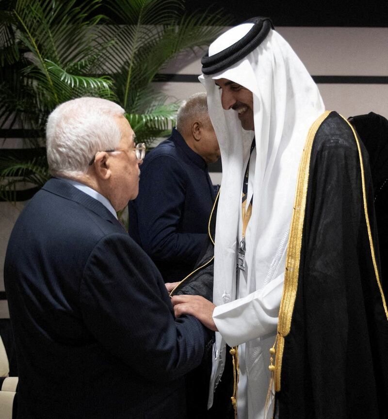 Palestinian President Mahmoud Abbas is received by Sheikh Tamim in Doha. Qatar News Agency / Reuters
