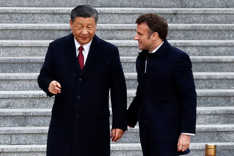 President Xi and President Macron at the Great Hall of the People in Beijing on Thursday. AFP