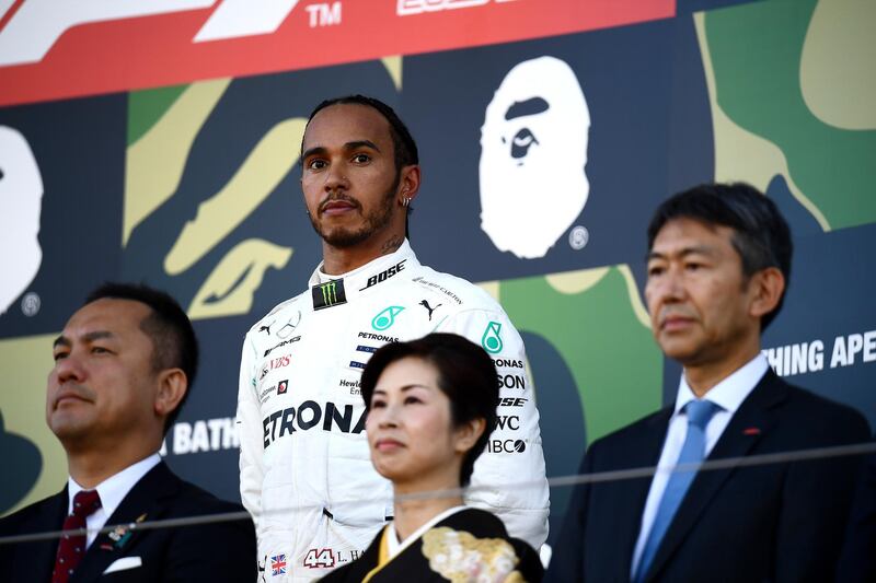 SUZUKA, JAPAN - OCTOBER 13: Third placed Lewis Hamilton of Great Britain and Mercedes GP looks on, on the podium during the F1 Grand Prix of Japan at Suzuka Circuit on October 13, 2019 in Suzuka, Japan. (Photo by Clive Mason/Getty Images)