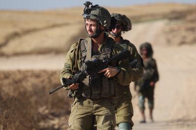 Israeli soldiers patrol along the border with the Gaza Strip. EPA