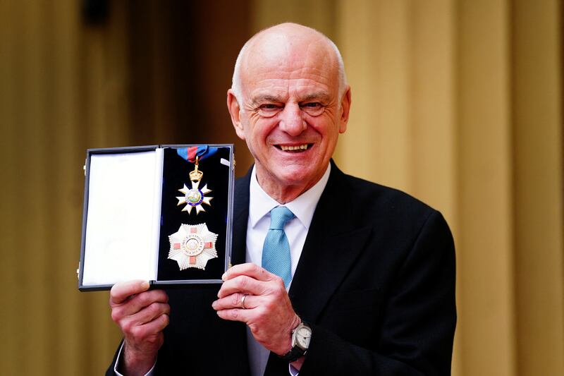 David Nabarro poses after he was made a Knight Commander of the Order of St Michael and St George during an investiture ceremony at Buckingham Palace in London. Reuters