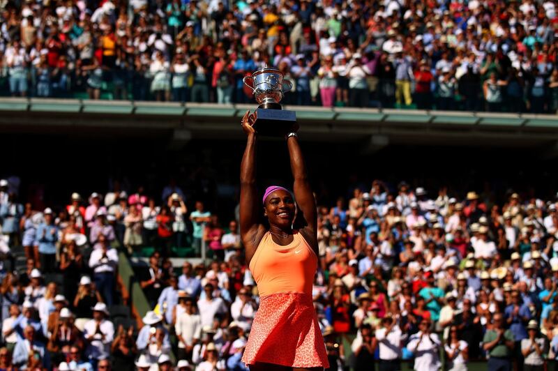 PARIS, FRANCE - JUNE 06:  Serena Williams of the United States lifts the Coupe Suzanne Lenglen trophy after winning the Women's Singles Final against Lucie Safarova of Czech Republic on day fourteen of the 2015 French Open at Roland Garros on June 6, 2015 in Paris, France.  (Photo by Dan Istitene/Getty Images)