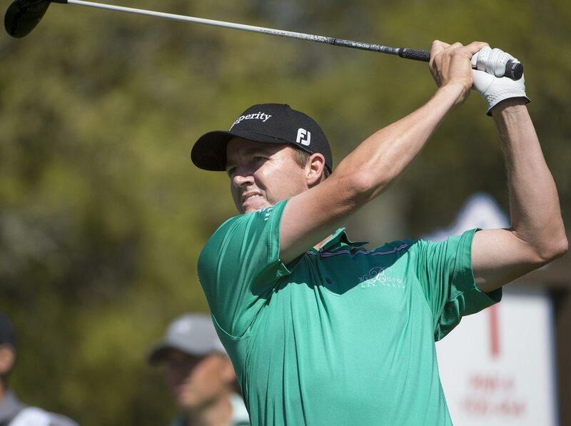Jimmy Walker hits from the first tee during the fourth round of the Valero Texas Open golf tournament, Sunday, March 29, 2015, in San Antonio. (AP Photo/Darren Abate)