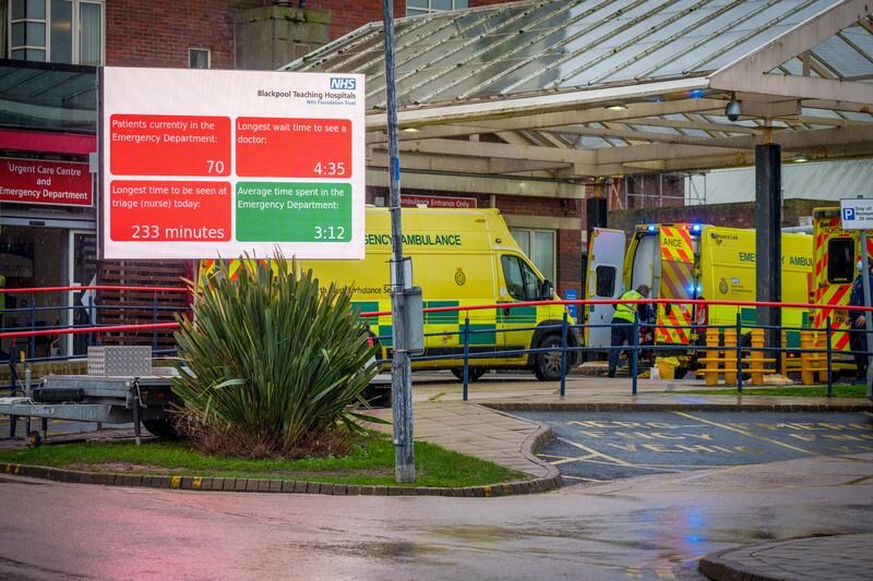 A digital sign displays current waiting times outside Blackpool Victoria Hospital on Thursday. By the New Year, nearly one in 10 NHS staff were off work. with 50,000 at home either sick or self-isolating with Covid-19. Getty Images