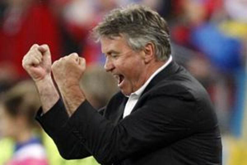 Guus Hiddink will combine managing Chelsea with his current role at Russia at least until the end of the Premier League season.