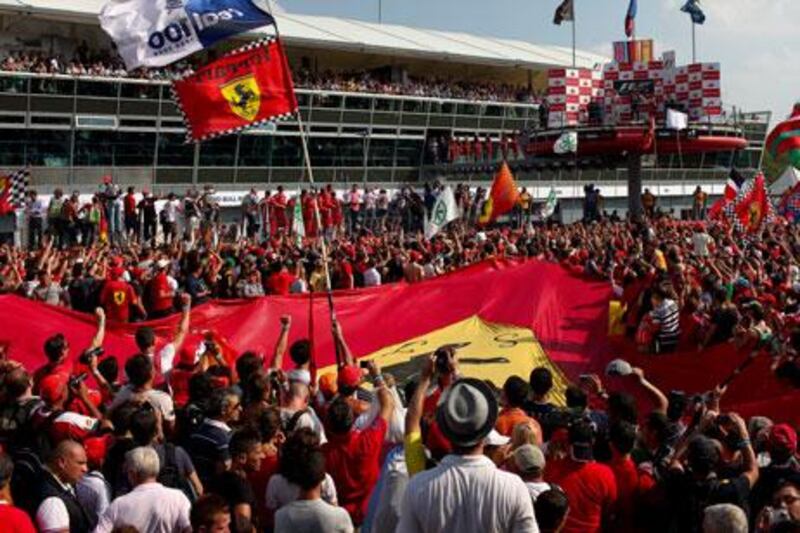 The gathering of fans in front of the podium even had race winner Sebastian Vettel of Red Bull Racing talking about what it would be like to win while 'wearing red'.