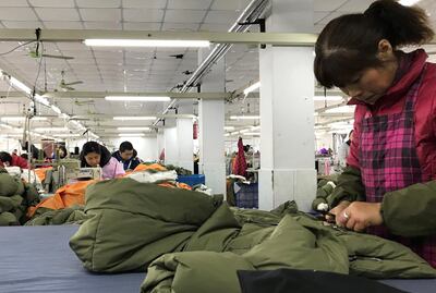Workers make Orolay jackets at the company's factory complex in Jiaxing, Zhejiang province, China January 28, 2019. Picture taken January 28, 2019. REUTERS/Pei Li